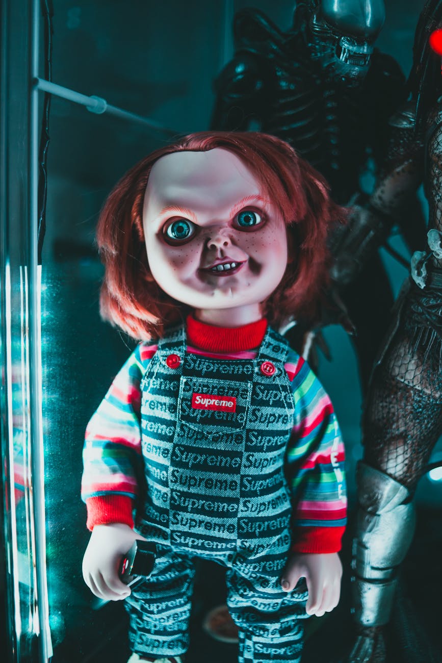 doll with terrible face in overalls at home