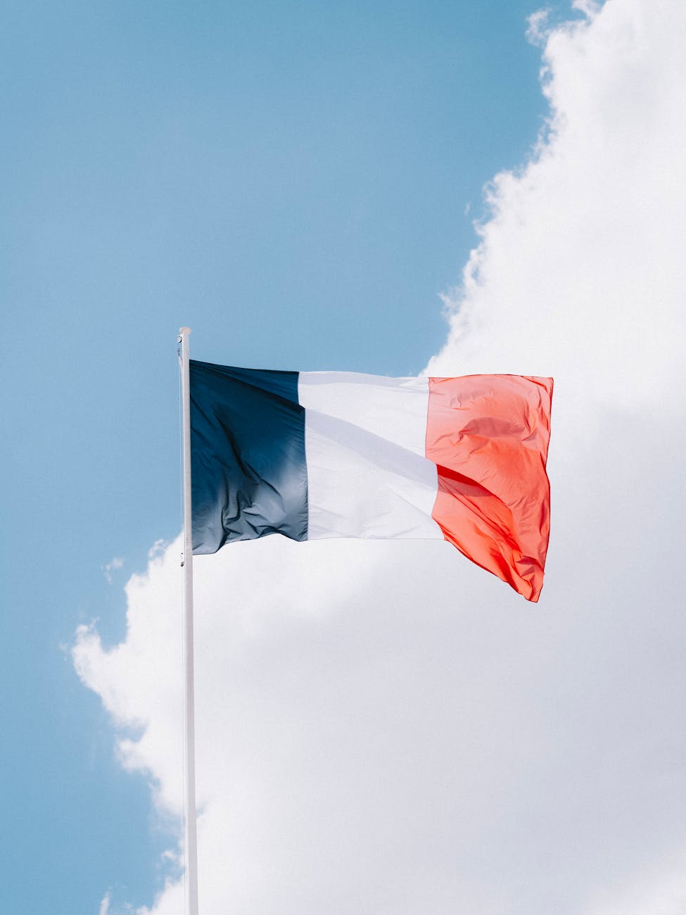 clouds behind french flag