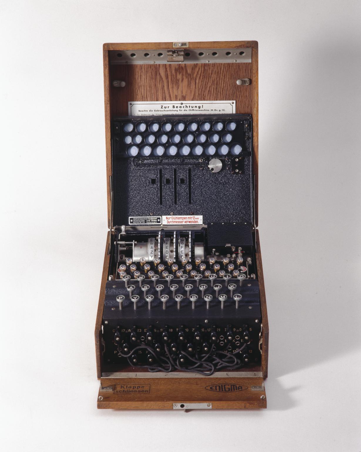 Three-ring Enigma cypher machine in oak wood transit case