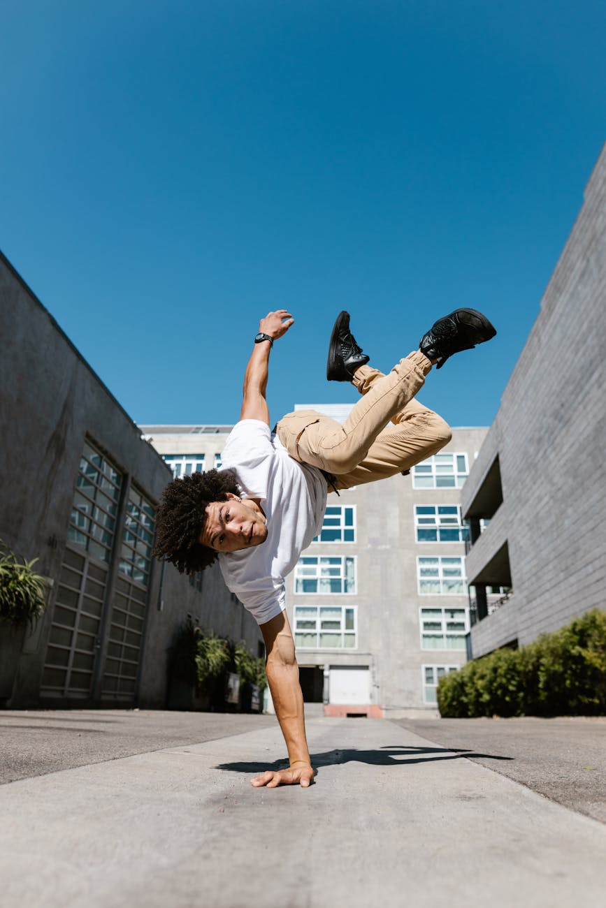 a man breakdancing in an urban area